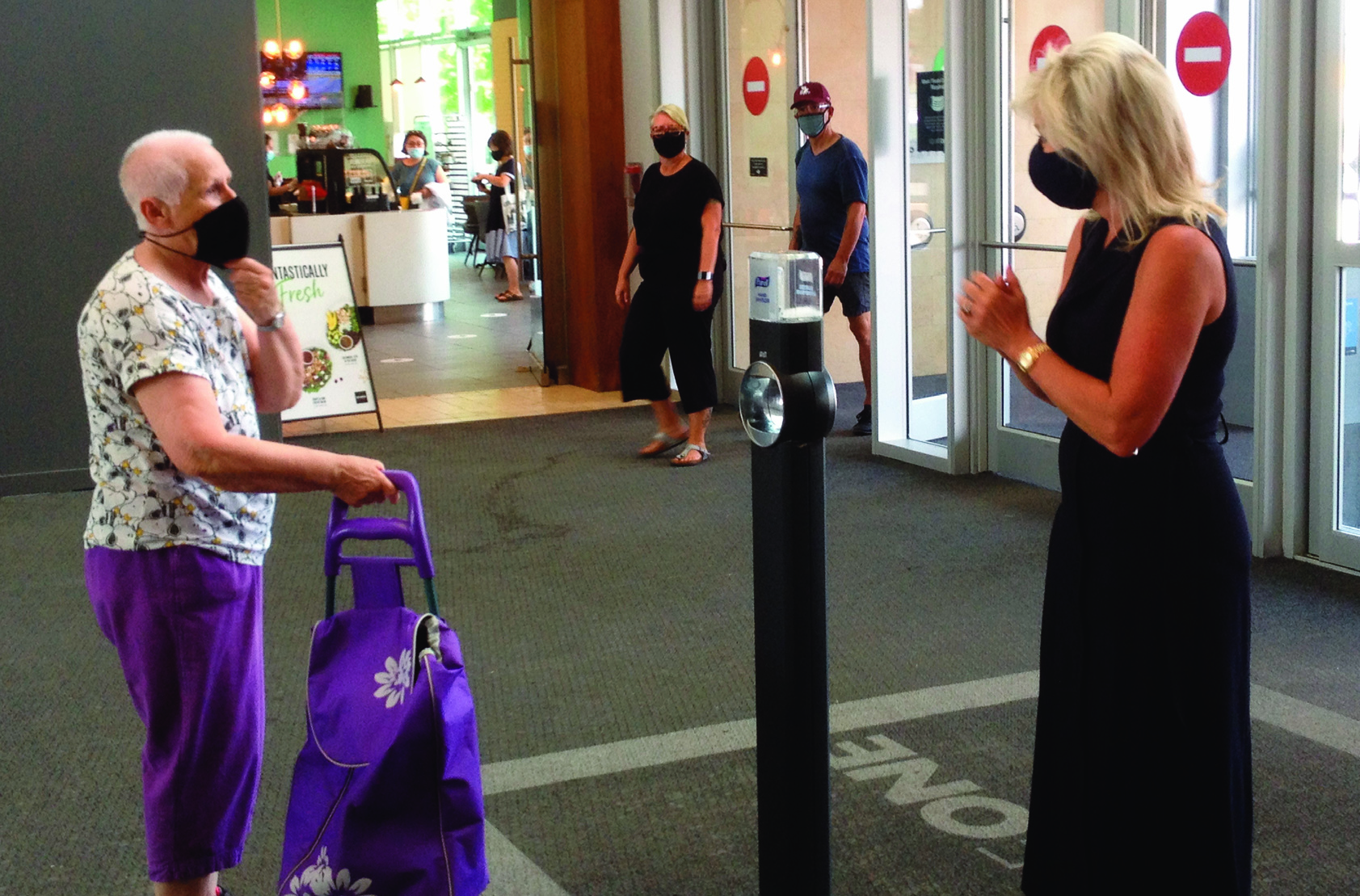 Residents put on mandatory masks as indoor spaces reopen