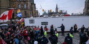 Canadian police arrest two leaders of protesting truckers