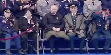 Rumours over Putin’s health renewed as he sits with blanket in parade